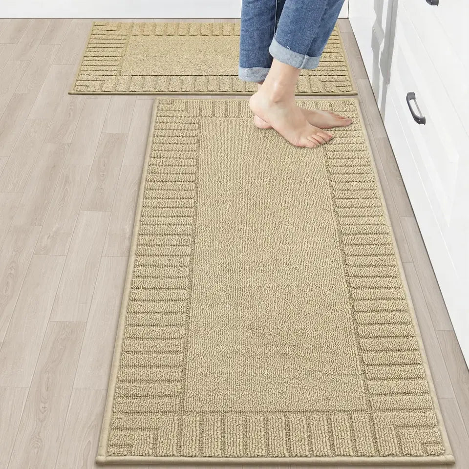 Beige rug on a wooden floor with a person stepping onto it